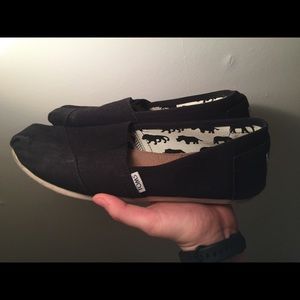 Black toms slip ons